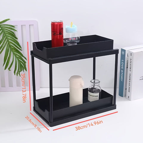 Two-tier pull-out storage rack. An organizational lifesaver for under the kitchen sink. Features adjustable shelves for easy storage of bottles and jars. In a sleek, modern design. Perfect as a kitchen shelf, bathroom organizer, or household storage solut