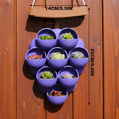 3D-printed grape pots in purple, brown, and green.