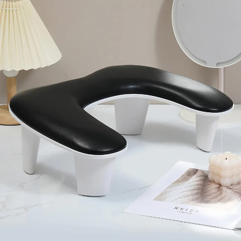 BLACK This handheld nail care device integrates a U-shaped pillow and comes with a portable detachable stand. Designed with an inclined PU material and a sturdy base, it is crafted for both comfort and portability.