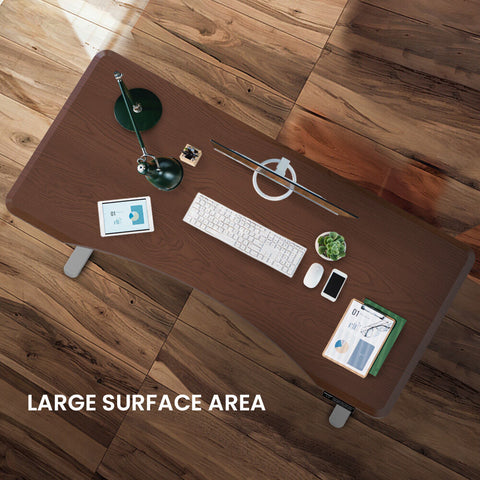 FORTIA Sit To Stand Up Standing Desk, 160x70cm, 72-118cm Electric Height Adjustable, Ergonomically Curved Edge, 50kg Rated, Walnut Style/Silver Frame